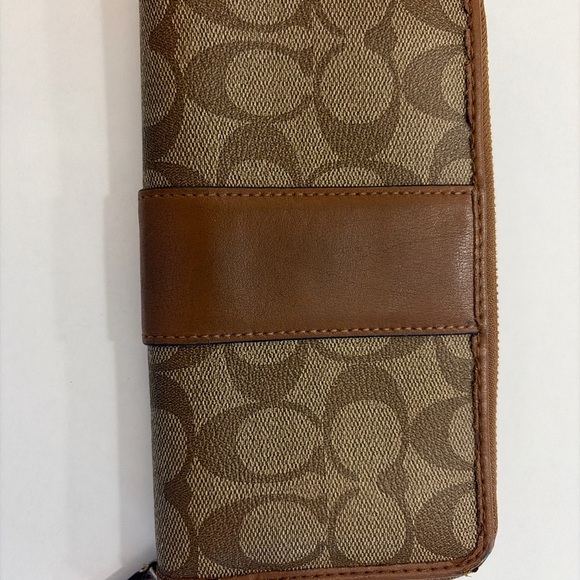Coach Tan and Brown Signature Zip Wallet
PROJECT - Picture 4 of 9